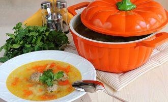 Pour hot, fresh soup with meatballs into bowls and serve with sour cream and fresh herbs if desired.