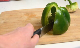 Dry it a little, then cut off the stems and cut each pepper in half. 