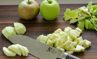 How to bake apple strudel from puff pastry in the oven? Peel the apples and remove the core and seeds. Chop the apples into small cubes and place them in a separate bowl.