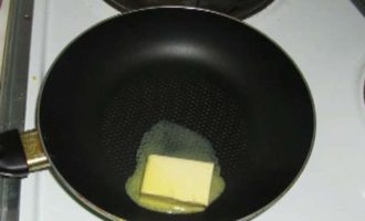 Melt two tablespoons of butter in a frying pan over low heat.