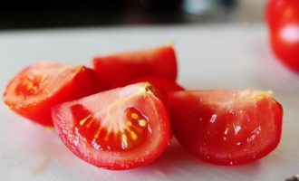 Cut each tomato half into 2-4 pieces depending on the size of the vegetable.