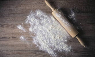 Dust your work surface with flour and place the dough there. 