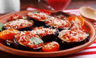 Eggplants with tomatoes and garlic, fried in a pan