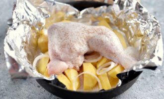 Turn the oven to 180 degrees until it is fully heated. Then place the chicken on the potatoes, add a little water and wrap the semi-finished dish with foil, leaving no exposed areas. Place the container with the dish in the already hot oven for 40 minutes in convection mode.