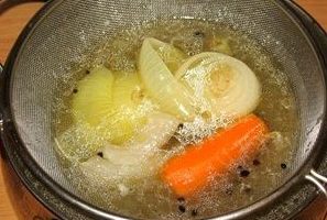 Remove meat and bones from the finished broth and pass the liquid through a sieve. Discard vegetables and whole spices.