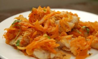 Pollock in the oven with carrots and onions