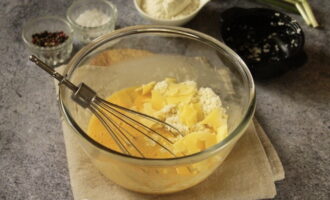 Add cheeses to the liquid mixture. They can be grated, broken by hand or chopped. At your discretion.