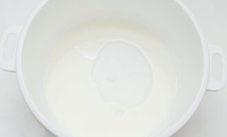 Pour the milk into a convenient container and heat it on the stove, but do not bring it to a boil.