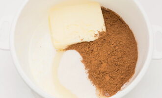 Put soft butter in milk, add sugar and cocoa. 