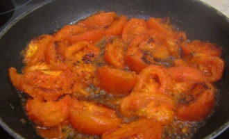 Reduce heat to medium and fry tomatoes until softened.