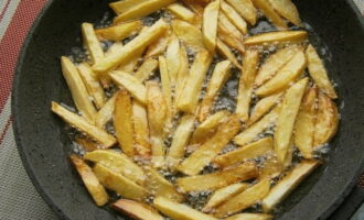 Fry until brightly browned for about 5-7 minutes. Turn over with a slotted spoon.