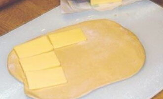 Place slices of butter on each layer of dough.