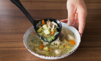 Pour hot cabbage soup from fresh cabbage into plates and serve. Ready!