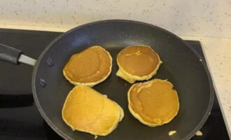 Using a wooden or silicone spatula, flip the pancakes over to the other side and cook for a couple more minutes.