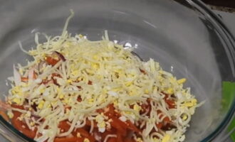 Grate the hard cheese and add it to the rest of the ingredients.