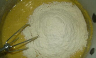 Next, add flour and stir the dough until smooth.