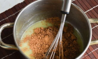 Add cocoa to the hot mixture. Beat with a whisk.