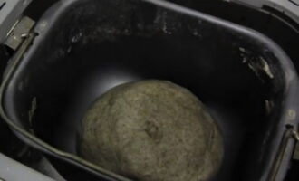 Place the dough back into the bread machine bowl.