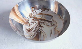 Add the required amount of cream to the ganache and mix using a silicone spatula. 