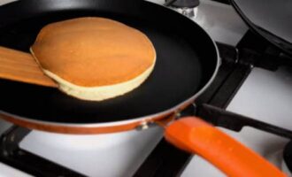 Using a spatula, turn the product over and fry until golden brown on the other side.