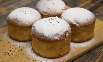 Remove the cooled cakes from the mold and sprinkle generously with sifted powdered sugar and any brightly colored sprinkles. 