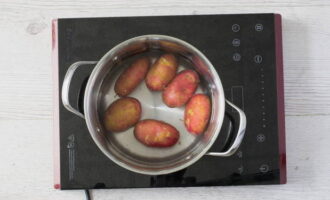 How to prepare okroshka at home? Wash the potatoes and boil them in their skins.