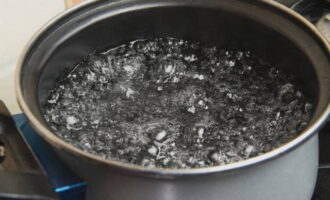 Place a pot of water on the stove and bring to a boil.