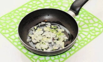 Finely chop the peeled onion and fry until light golden brown in hot vegetable oil.