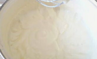 Add soft butter to the cooled mixture. Beat the cream with a mixer until it becomes a slightly white, fluffy, dense mass.