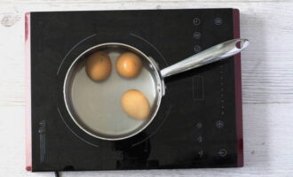 Wash and hard boil the eggs.