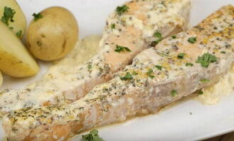 Transfer the finished salmon to a serving dish, sprinkle with chopped fresh parsley and serve with your favorite side dish. 