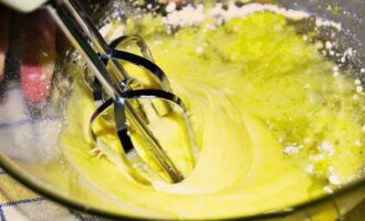 Beat eggs into the mixture. Beat with a whisk or fork until smooth.