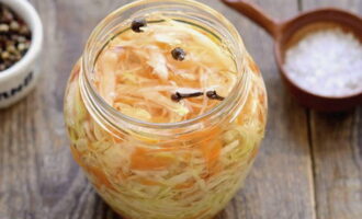 Wash and sterilize jars for storing cabbage well. Place the cabbage in jars and compact well. Leave some free space at the top of the jar.Pour the hot marinade into the jars until it fills the entire space to the top and screw on the screw caps.