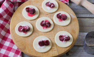 Place a little cherry filling on each circle of dough.