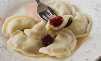 Serve the dumplings hot with cherry sauce.