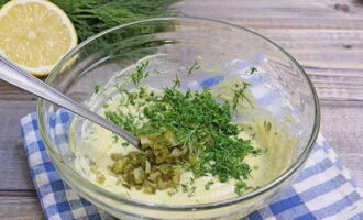 Add chopped pickles and herbs into the mixture. 