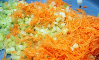 Add grated carrots and pieces of celery to it. Simmer the vegetables for 7-10 minutes.