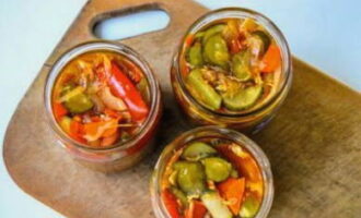 Place the vegetable mixture in sterilized glass jars. We close them with sterilized lids. A bright hunting salad for the winter is ready! Store it in a cool place.