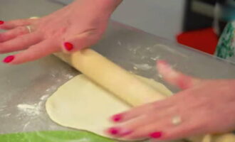 Roll each piece of dough into a thin circle.