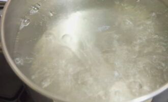 When the water starts to boil, add salt to taste.