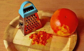 Pour boiling water over the orange, wash and grate the zest on a fine grater.