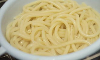 Drain the finished pasta in a colander, then transfer to a plate and add butter. 