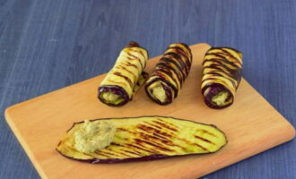 Place about a teaspoon of filling on the wide part of the eggplant strip and roll it up. Do this with all the eggplant strips.