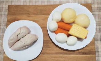 How to make a simple and tasty salad with chicken breast? Boil chicken, potatoes, carrots and eggs in salted water.