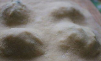 Cover it all with the second half of the dough. Gently press the edges with your fingers.