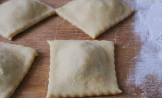 Cut the dough with filling into squares. Boil them in boiling water for no more than 4 minutes.