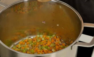 Then pour olive oil into a deep pan and heat it over low heat. Place vegetables in hot oil to fry.After about five minutes, add salt, ground black pepper, a chopped sprig of rosemary and continue frying until a nice golden brown.