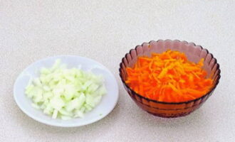 Grate the carrots on a large or medium grater, and chop the onion with a knife.