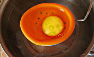 Add salt and table vinegar to boiling water, reduce heat to low and carefully pour the egg into the center of the pan.