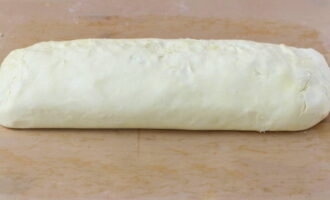 Then lift the edges of the dough and pinch them together, forming the pie into a loaf.